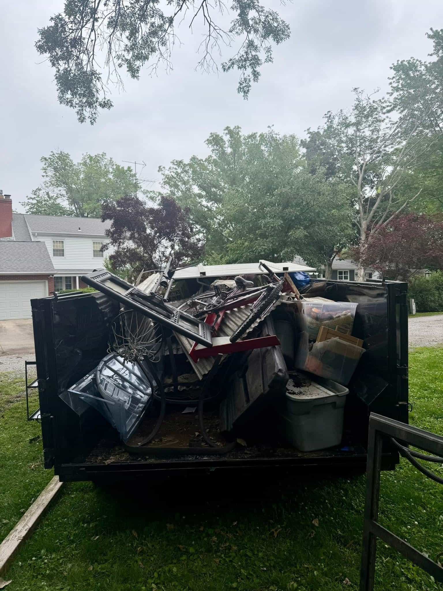 Loaded dump trailer during a residential cleanout
